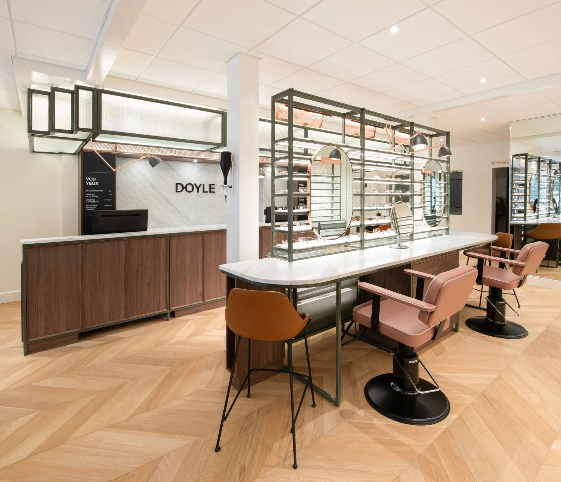 Interior of a Doyle eyewear store with counter and fitting chairs